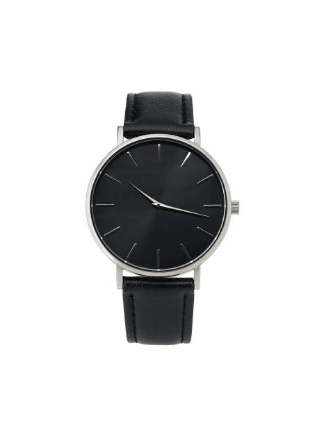 Classic women silver watch black dial, leather strap, isolate on white background Classic women's Silver watch with a black dial, leather strap, isolate on a white background. Front view. belt leather isolated close up stock pictures, royalty-free photos & images
