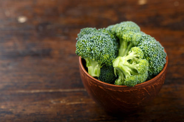 istock Fresh broccoli cabbage on a brown wooden table in a plate. 1137736948