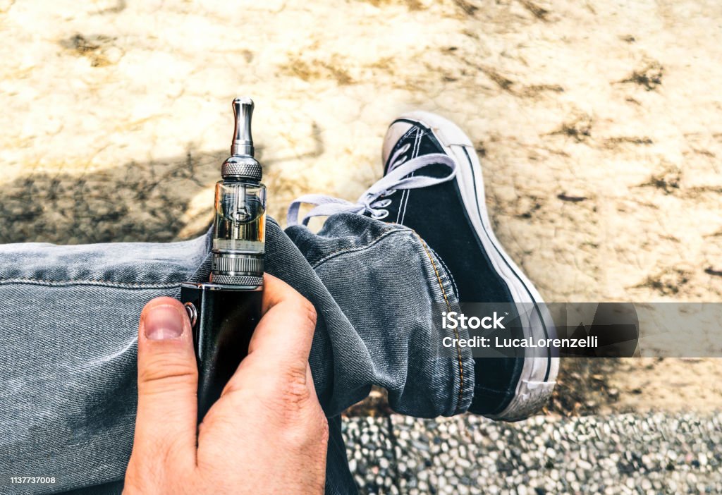 ecig addiction young people electronic cigarette electric smoker addiction vaping ecig addiction young people electronic cigarette electric smoker addiction vaping . Electronic Cigarette Stock Photo