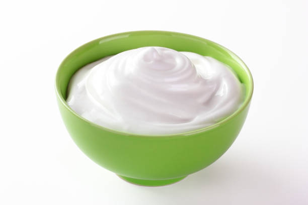 istock cream sour in a plate isolated white backround 1137739210