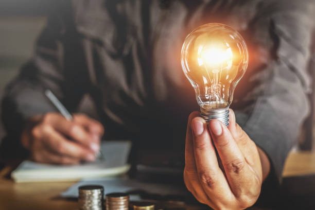 istock businessman hand holding light bulb. idea concept with innovation and inspiration 1137739275