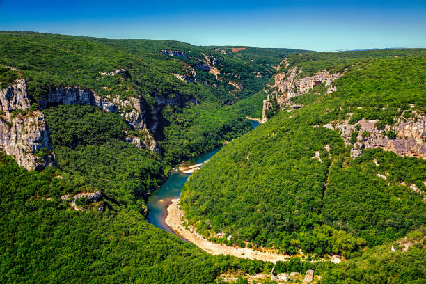 A Bend in the Ardeche River in Gorges de l'Ardeche, South-Central France A bend in the Ardeche river in Gorges de l'Ardeche, South-Central France auvergne rhône alpes stock pictures, royalty-free photos & images