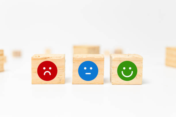 istock smiley face on wood block cube - business services rating customer experience, Satisfaction survey concept - Feedback 1137741894