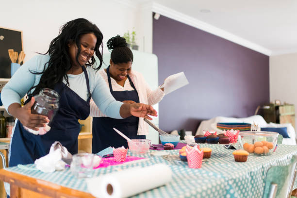 istock Happy African entrepreneurs baking cupcakes to sell 1137742213
