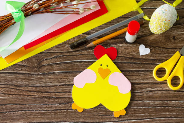 istock Easter postcard Easter chicken on a wooden table. Handmade. Project of children's creativity, handicrafts, crafts for kids. 1137744748