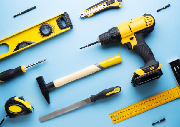 istock Creative provocation: a flat layout of yellow hand tools on a blue background. 1137746324