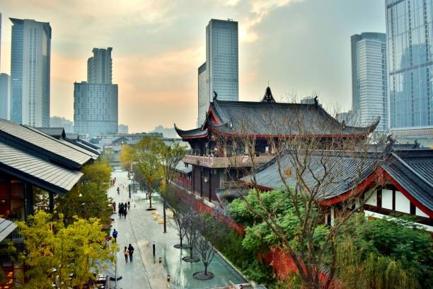 Aerial View of Traditional Chinese Temples in Chengdu's Modern Financial Center (Downtown) - Chengdu, China stock photo
