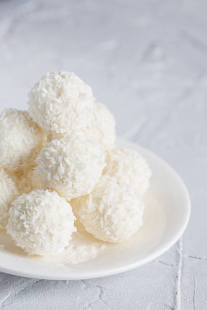istock Round, white candies in coconut flakes 1137755615