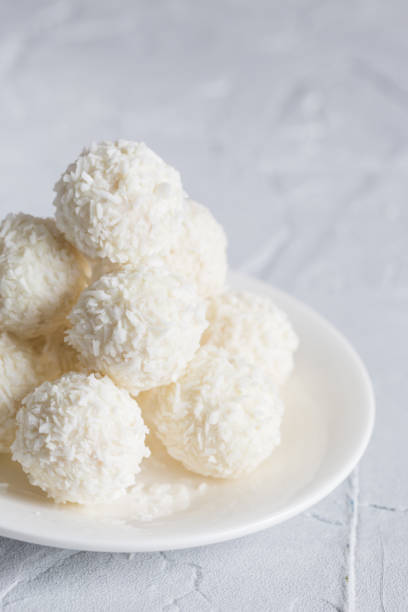 istock Round, white candies in coconut flakes 1137755633