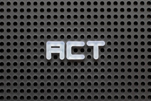 istock Black color pegboard with white letter in word act 1137759545