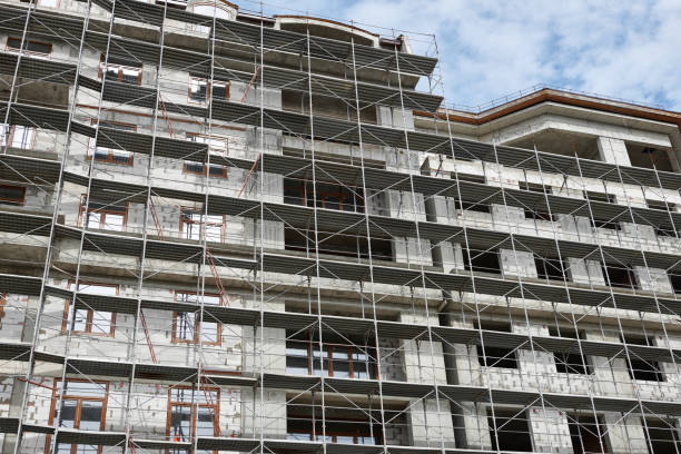 istock new building under construction, scaffolding and concrete 1137759568