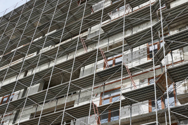 istock new building under construction, scaffolding and concrete 1137760859
