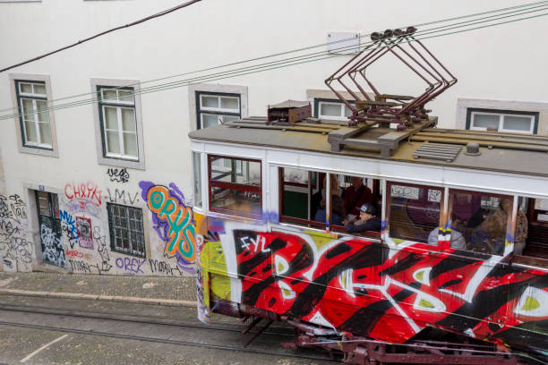 A tram on the streets of Lisbon collects and drops off passengers during Spring of 2019