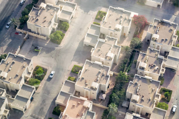 Doha, Qatar Suburb from Above Aerial View of a Traditional Residential Neighborhood (Compound) in Doha - Doha, the State of Qatar city street street corner tree stock pictures, royalty-free photos & images