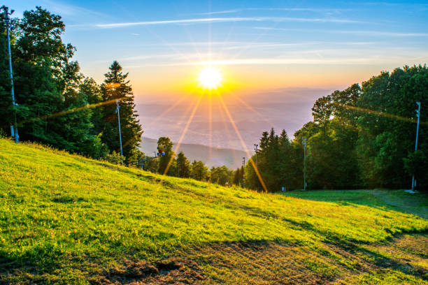Wide shot of picturesque sunset and forested landscape on Medvednica Mountain overlooking the countryside near Zagreb, Croatia