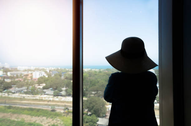 istock Silhouette woman looking view at the morning 1137762351