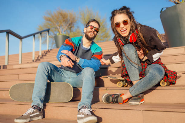 istock Man and woman sitting on stairs 1137763157