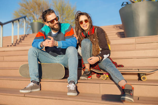 istock Man and woman sitting on stairs 1137763176