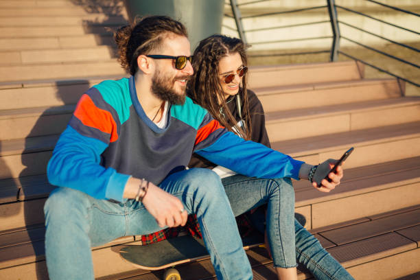 istock Young couple sitting on the stairs 1137763413