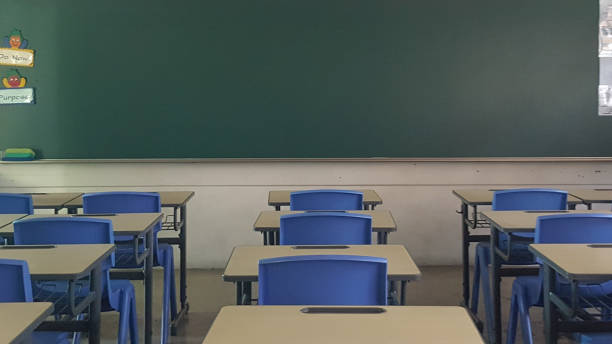 istock School classroom in blur background without young student; Blurry view of elementary class room no kid or teacher with chairs and tables in campus. 1137764127