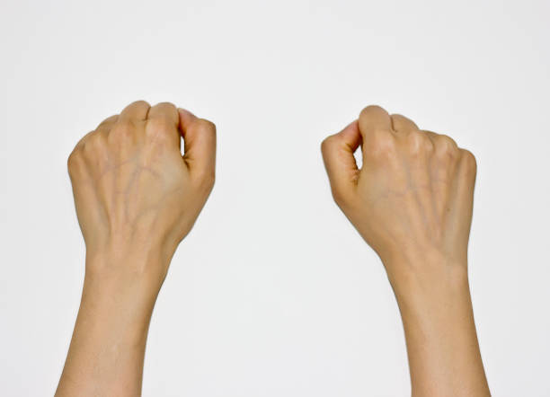 female hands holding up something on white