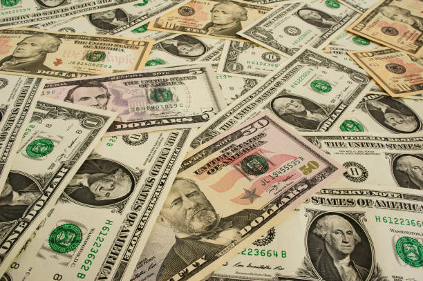 istock Background from money largely  1, 5, 10, 50  dollars 1137764584