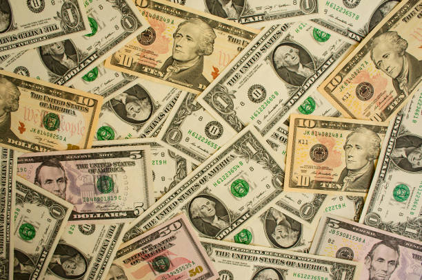 istock Background from money largely  1, 5, 10, 50  dollars 1137764628