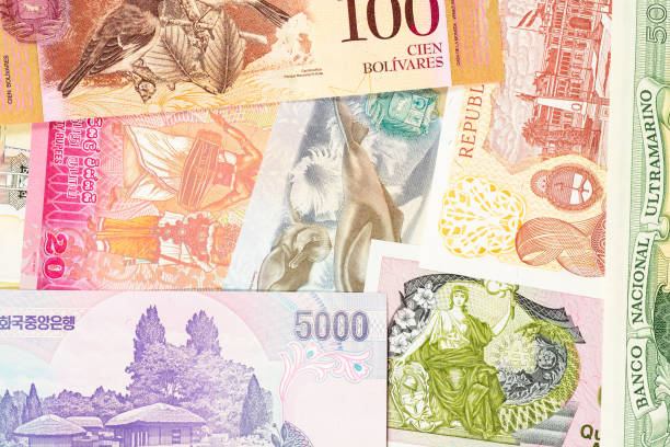 istock Old banknotes from different exotic countries. Colorful paper money background. Close-up macro. 1137767550