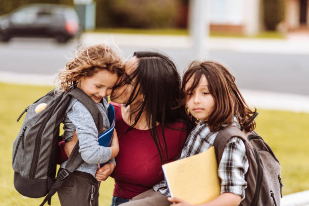 istock mother talking with sons after school 1137768740
