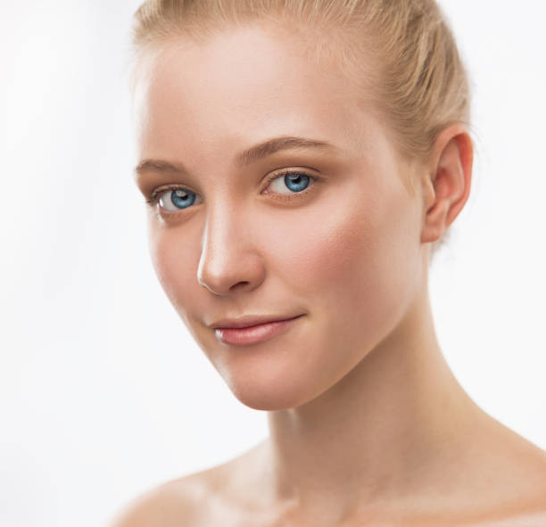 istock Face, serious, blue lenses, close up, white background 1137770349