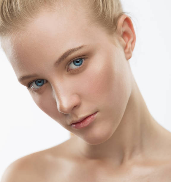 istock Face, serious, blue lenses, close up, white background 1137770360