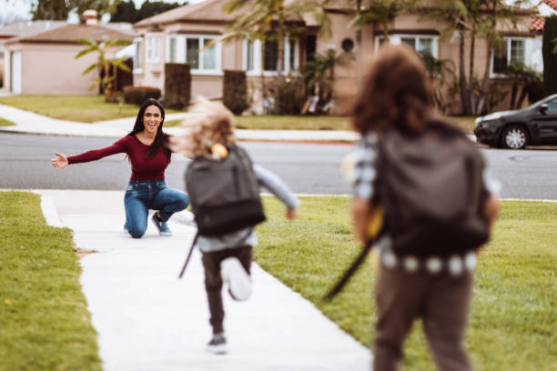 istock kids running to her mother after school 1137770429