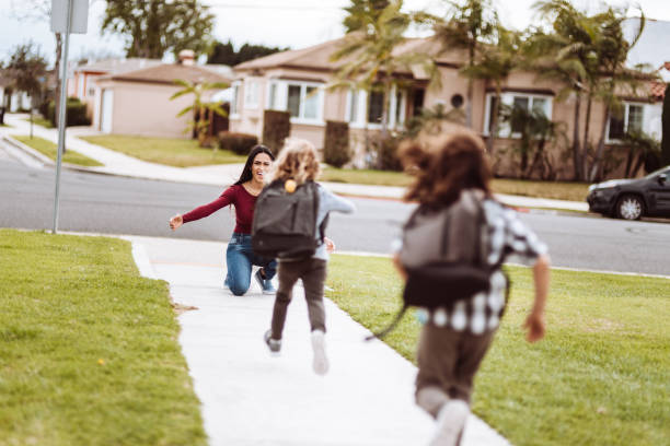 istock kids running to her mother after school 1137770559