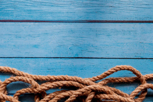 istock Rope on blue wooden background 1137770606