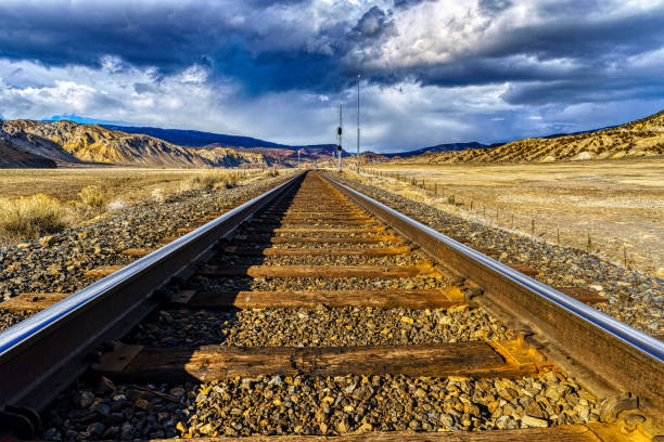 istock Train Tracks Going into Distance Scenic Canyon 1137770768