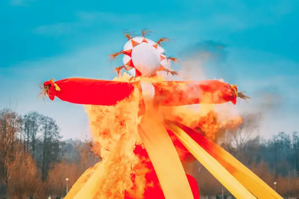 Photo of Belarus. Burning Effigies Straw Maslenitsa In Fire On Traditional National Holiday Dedicated To Approach Of Spring - Slavic Celebration Shrovetide
