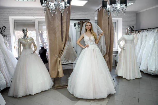 istock Beautiful bride in salon posing in wedding dress 1137773242