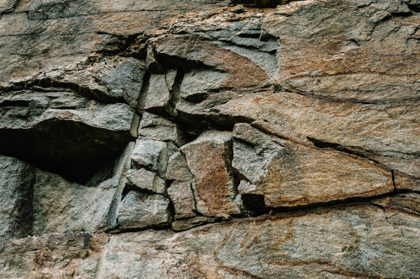 istock Stone texture background. The surface of granite and basalt. a large rock, a stone wall. close up. place for text. 1137773523
