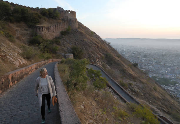 istock Woman walks up pathway above Jaipur 1137773586
