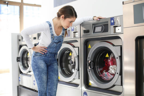 istock Woman washing her clothes 1137777270