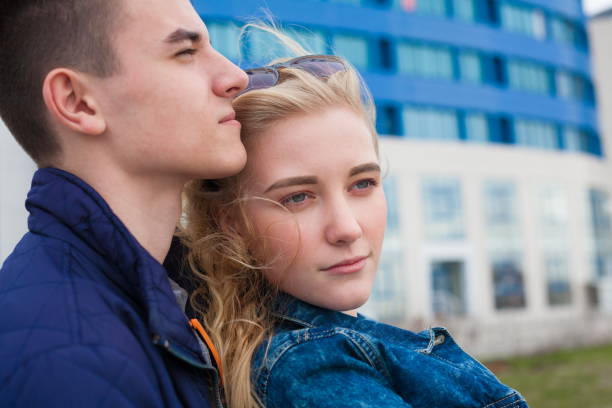 istock Girl and boy, jeans jacket, close up 1137779253