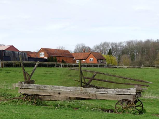 istock Abandoned wagon in farmland landscape 1137779838