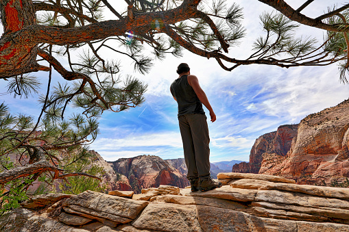 Young Hiker at the summit of Angels Landing Trail in Zion National Park, Utah