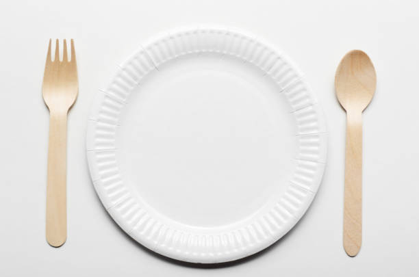 istock Top view at wooden single use kitchenware and paper plate on white background 1137780337