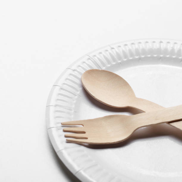 istock Wooden single use kitchenware and paper plate on white background 1137781197