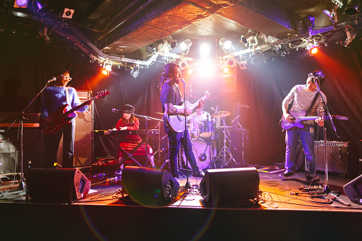 Small Group Musical Performance Multiethnic Music Performance Group Performing On Stage Stock Photo ...
