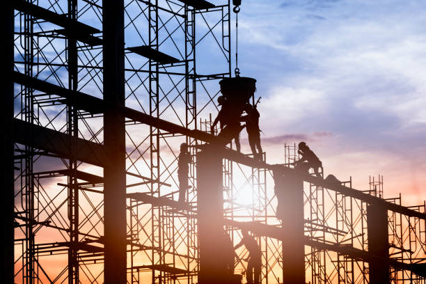 Construction worker. Silhouette of worker. Construction Building casting concrete work on scaffolding. scaffolding stock pictures, royalty-free photos & images