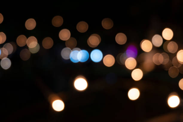 istock The light that blurts out is a beautiful Bokeh on a black background. 1137783962