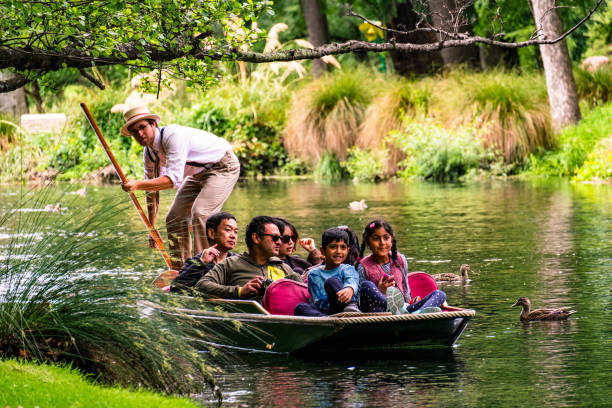 New Zealand, Christchurch 2018, DEC 22 - New Zealand, Christchurch, People are enjoing on the boat on the river in Botanic garden.. punting stock pictures, royalty-free photos & images