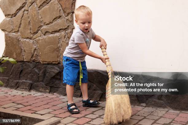 https://media.istockphoto.com/id/1137786199/photo/pretty-caucasian-baby-boy-with-blonde-hair-sweeps-the-yard-with-a-broom.jpg?s=612x612&w=is&k=20&c=eYWjer2ya7xXZ11w50K191N-xXYjxIcTcktK4pxNzW8=